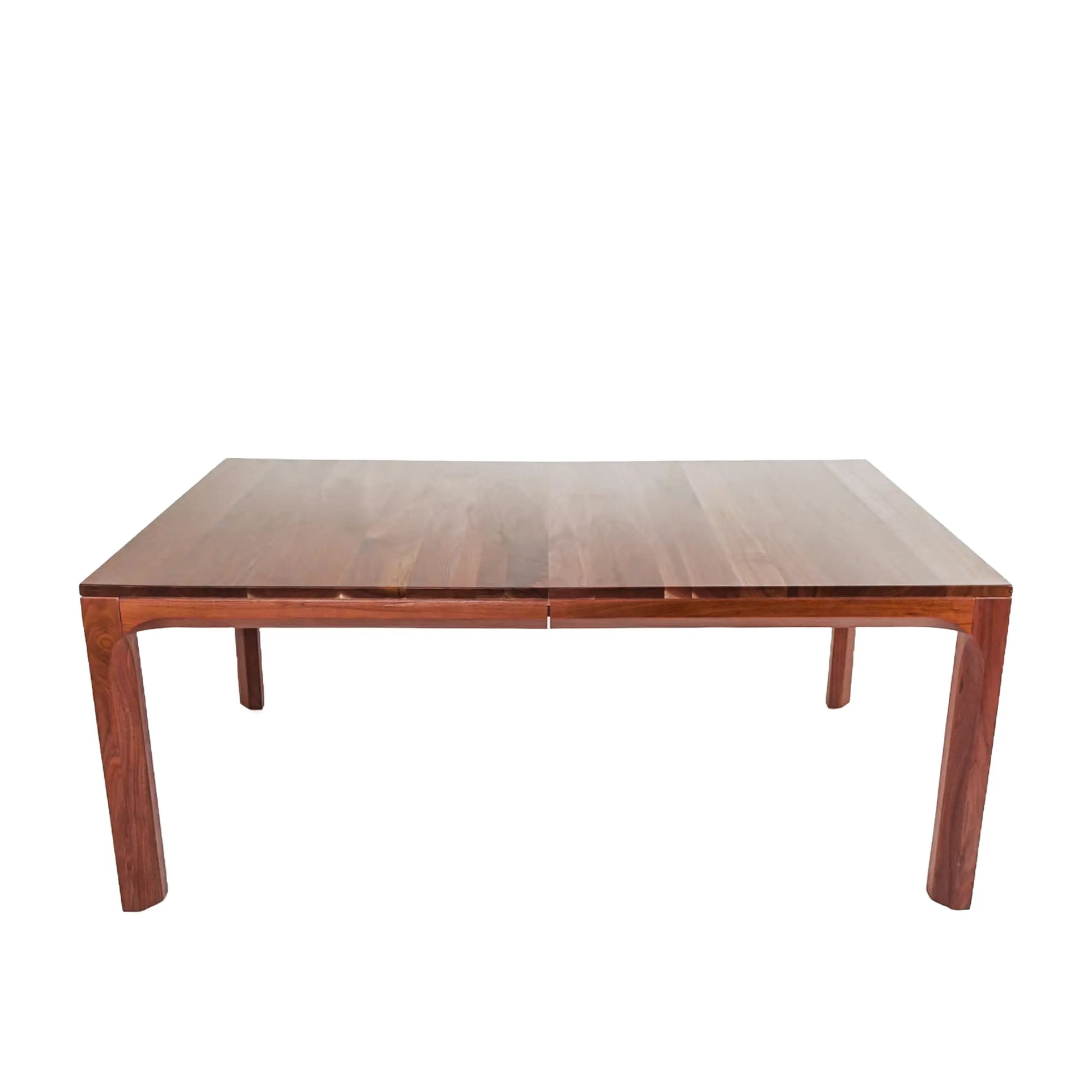 Compagno walnut dining table with a solid wood bench and orange chairs
