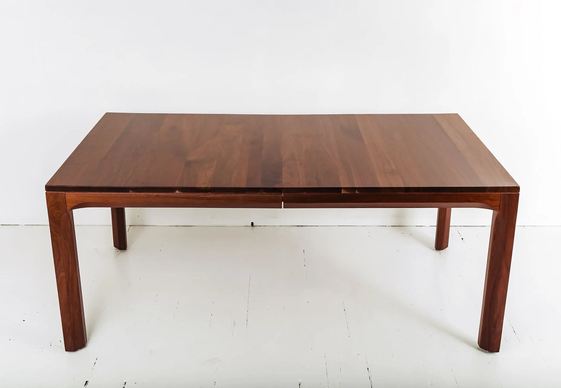 Eco-friendly walnut dining table with extendable leaves for small spaces
