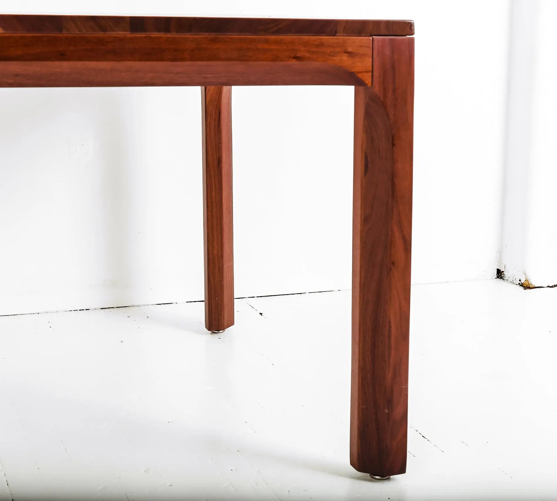 Walnut dining table with bench, ideal for mid-century modern interiors
