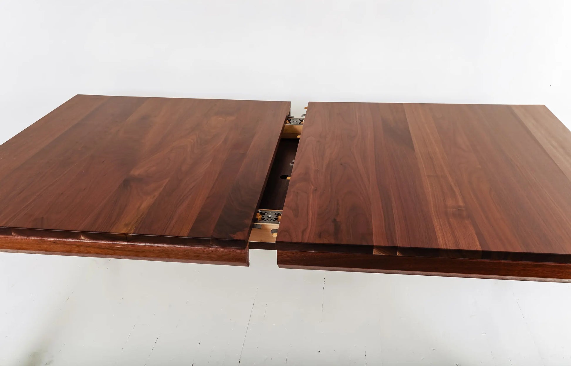 Sustainable dining table in walnut with modern, minimalist design elements
