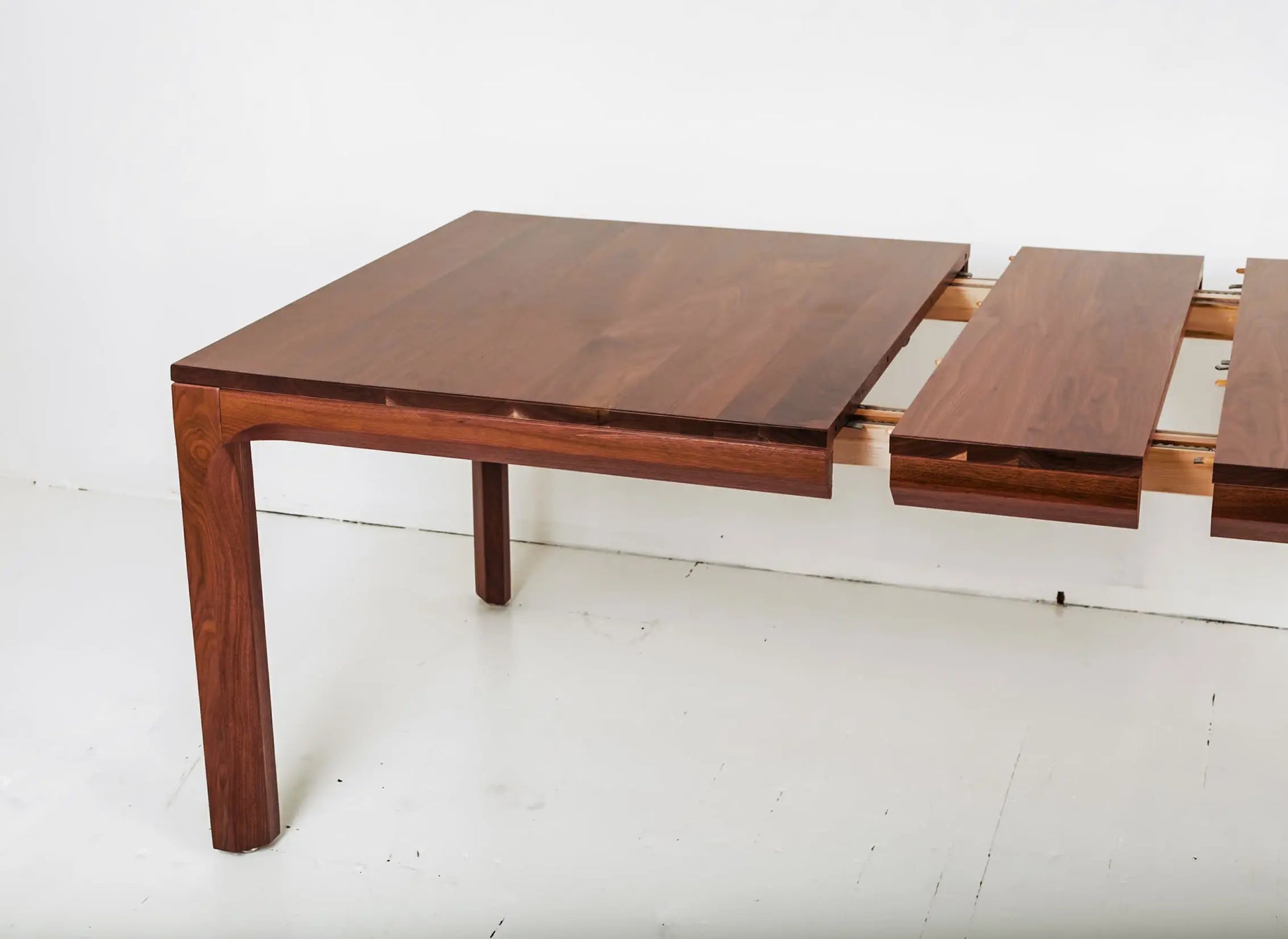 Solid walnut dining table with clean lines and sustainable craftsmanship
