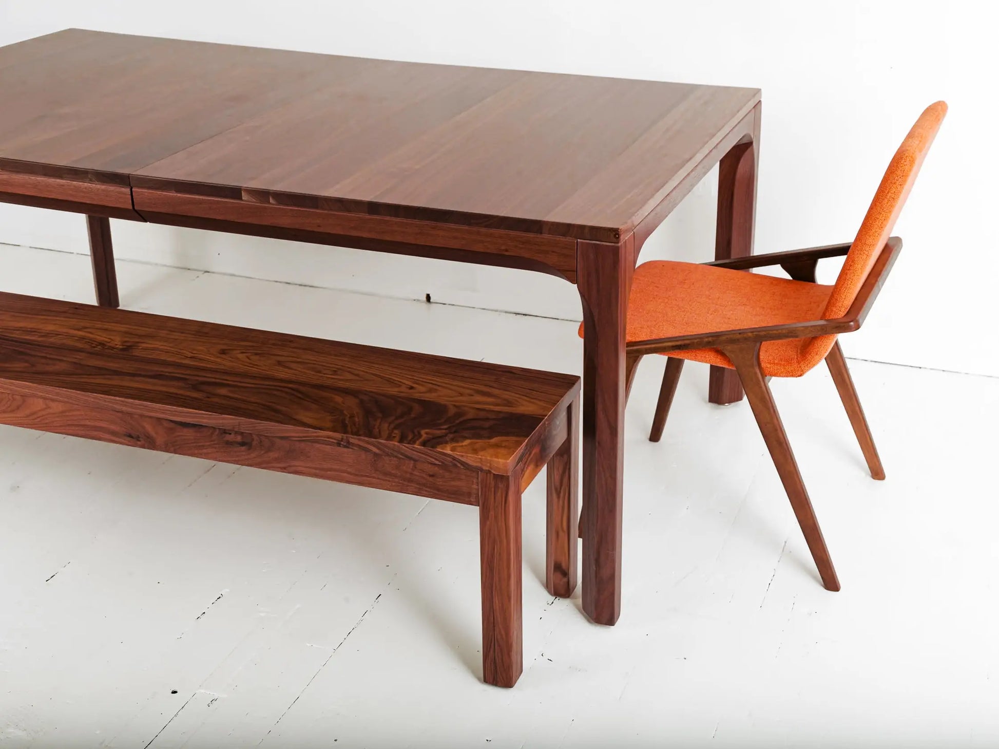 Walnut extendable dining table with Scandinavian-style interior decor
