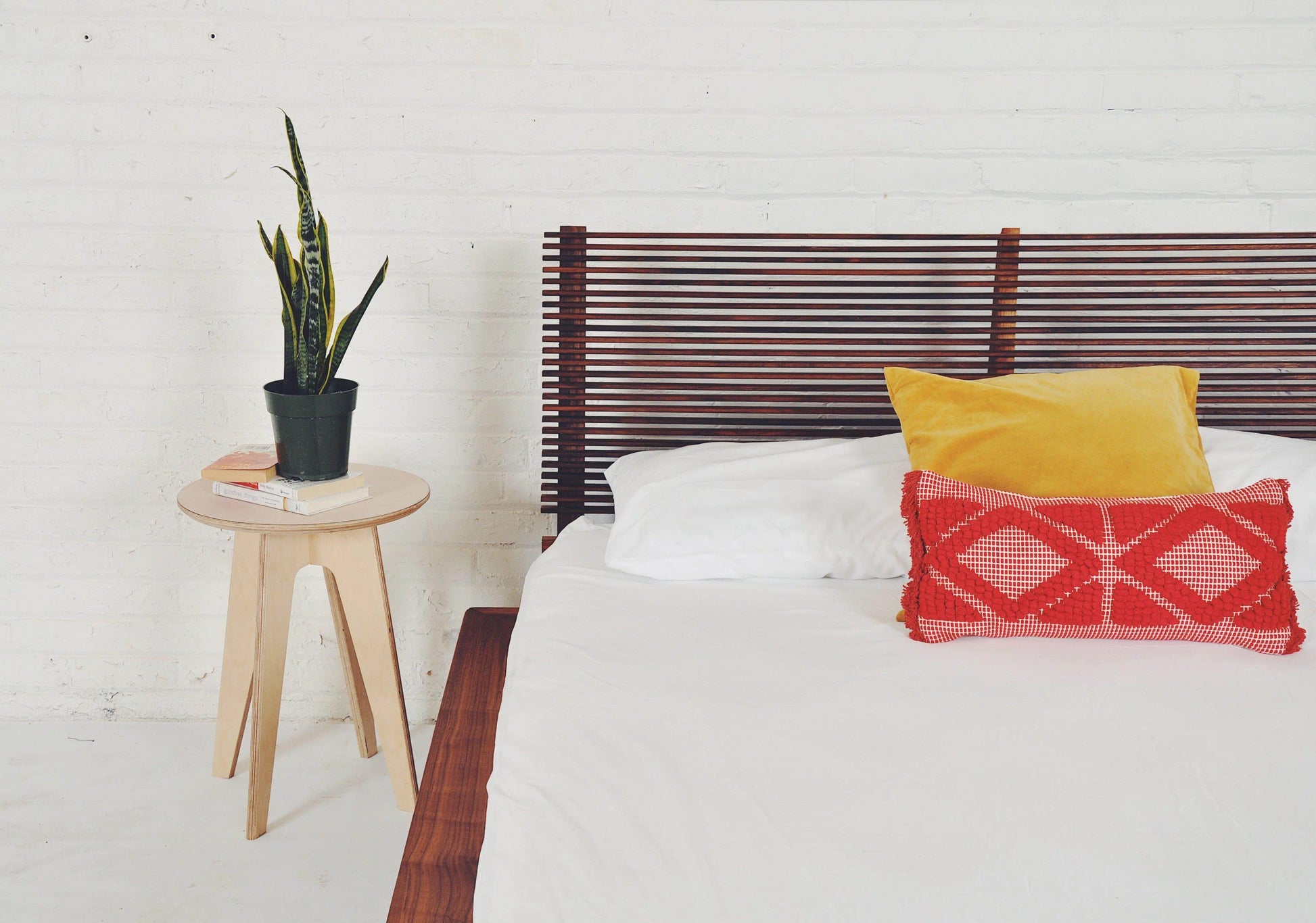 The Baxter Japandi Bed Frame displayed in a stylish bedroom setting