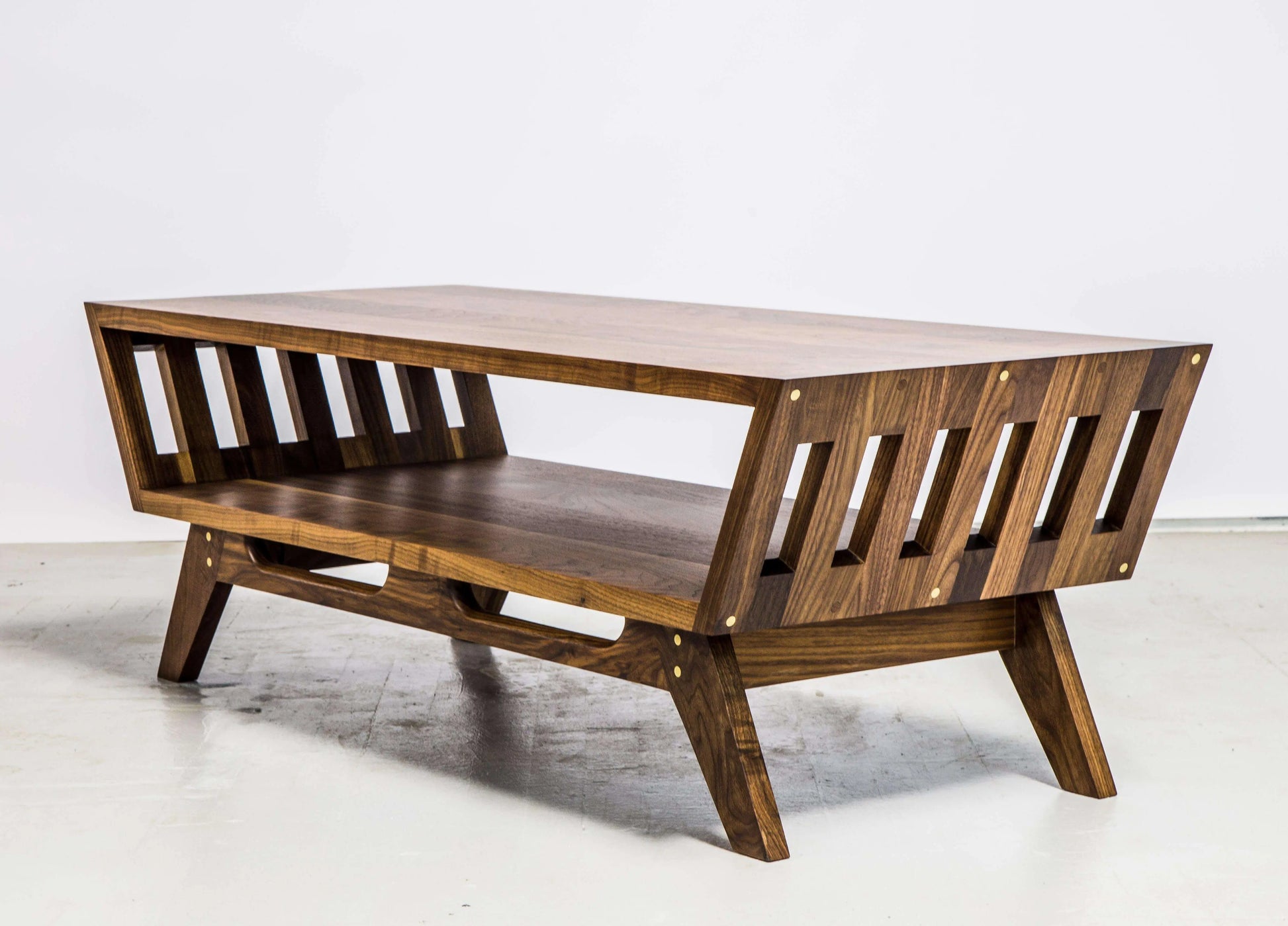 Modern walnut coffee table with slim legs and timeless design