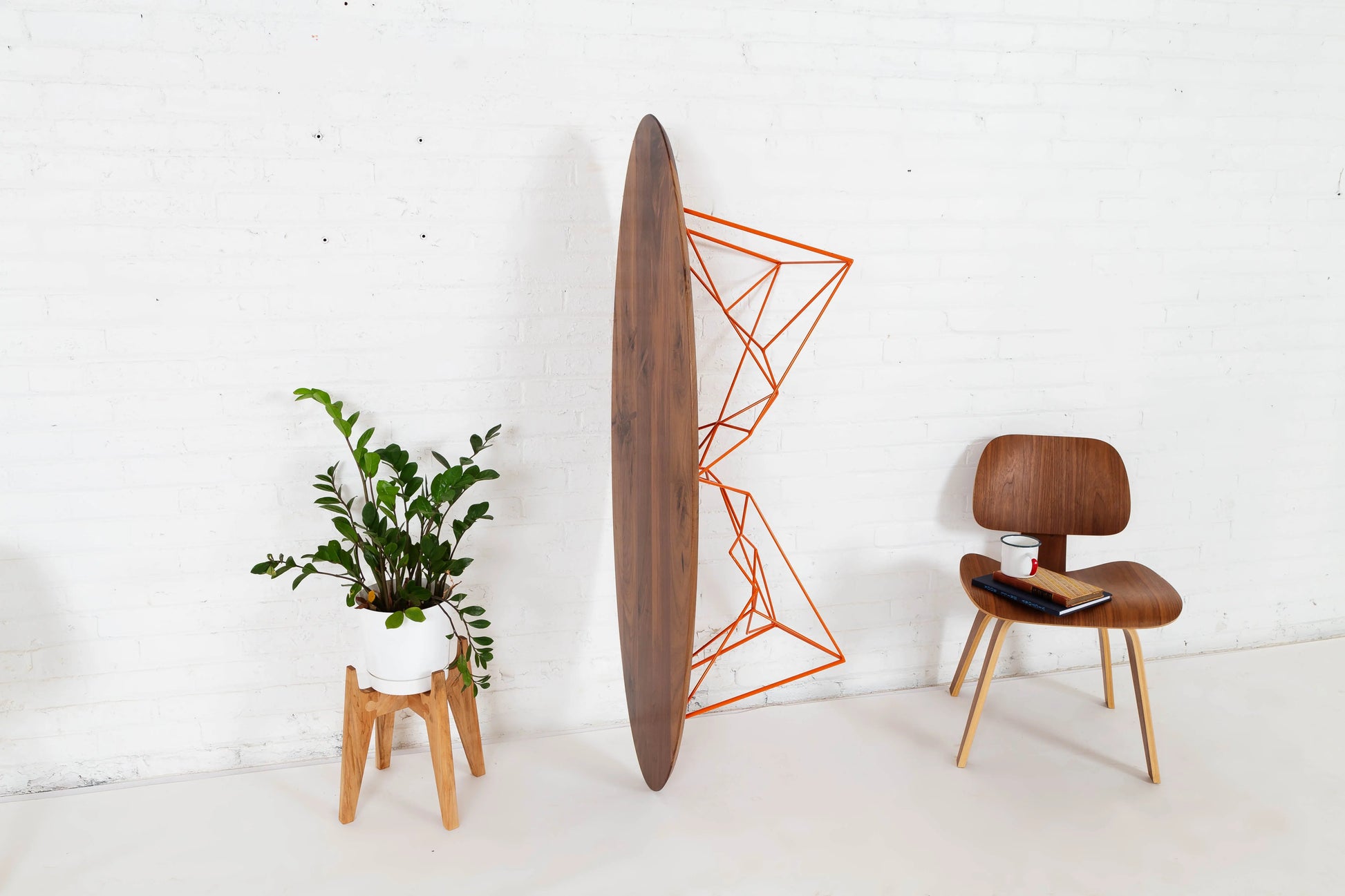 Mid-century inspired walnut coffee table with an oval top
