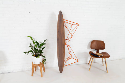 Mid-century inspired walnut coffee table with an oval top