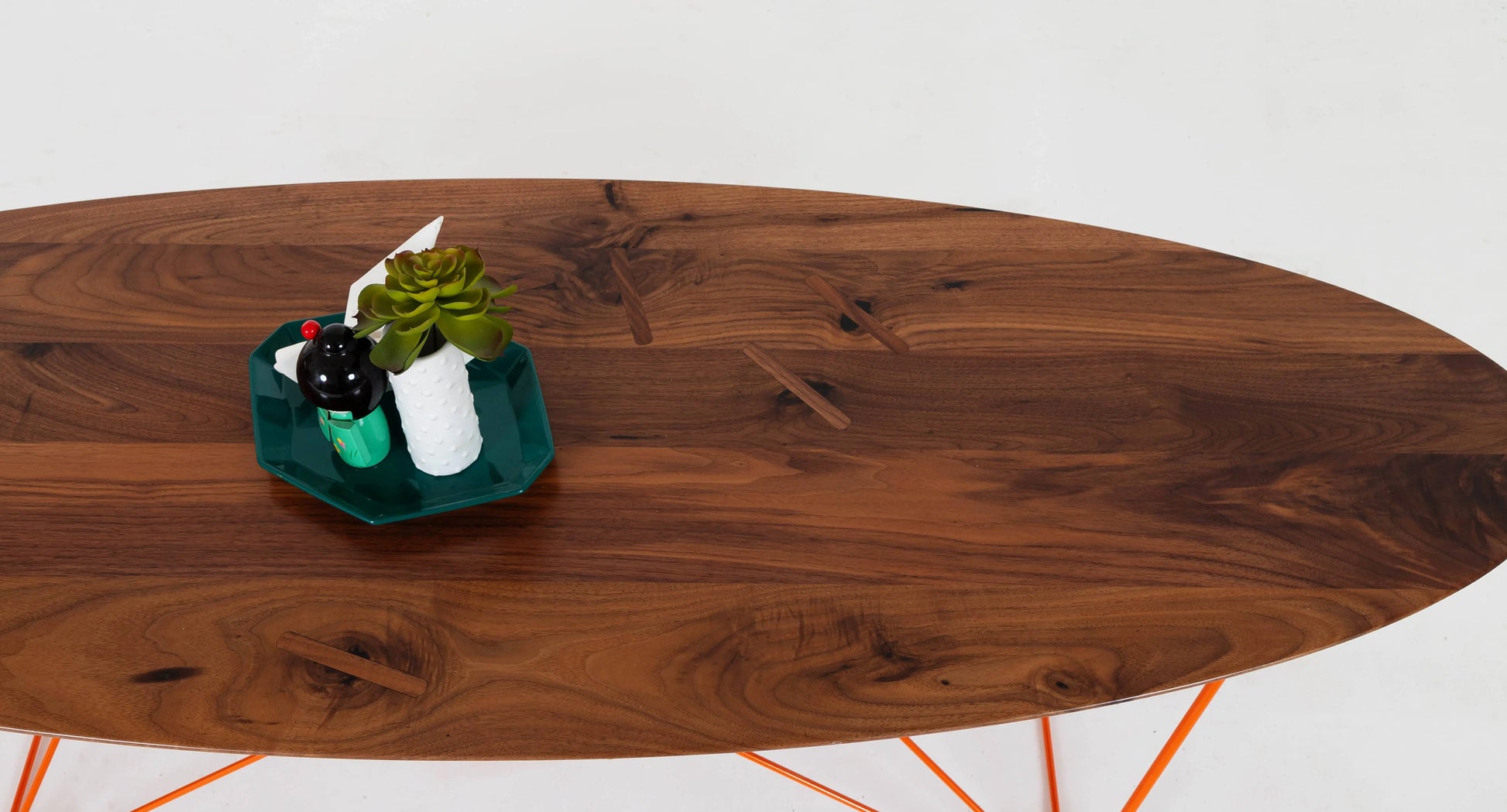 Solid walnut oval coffee table with a retro-inspired mid-century feel