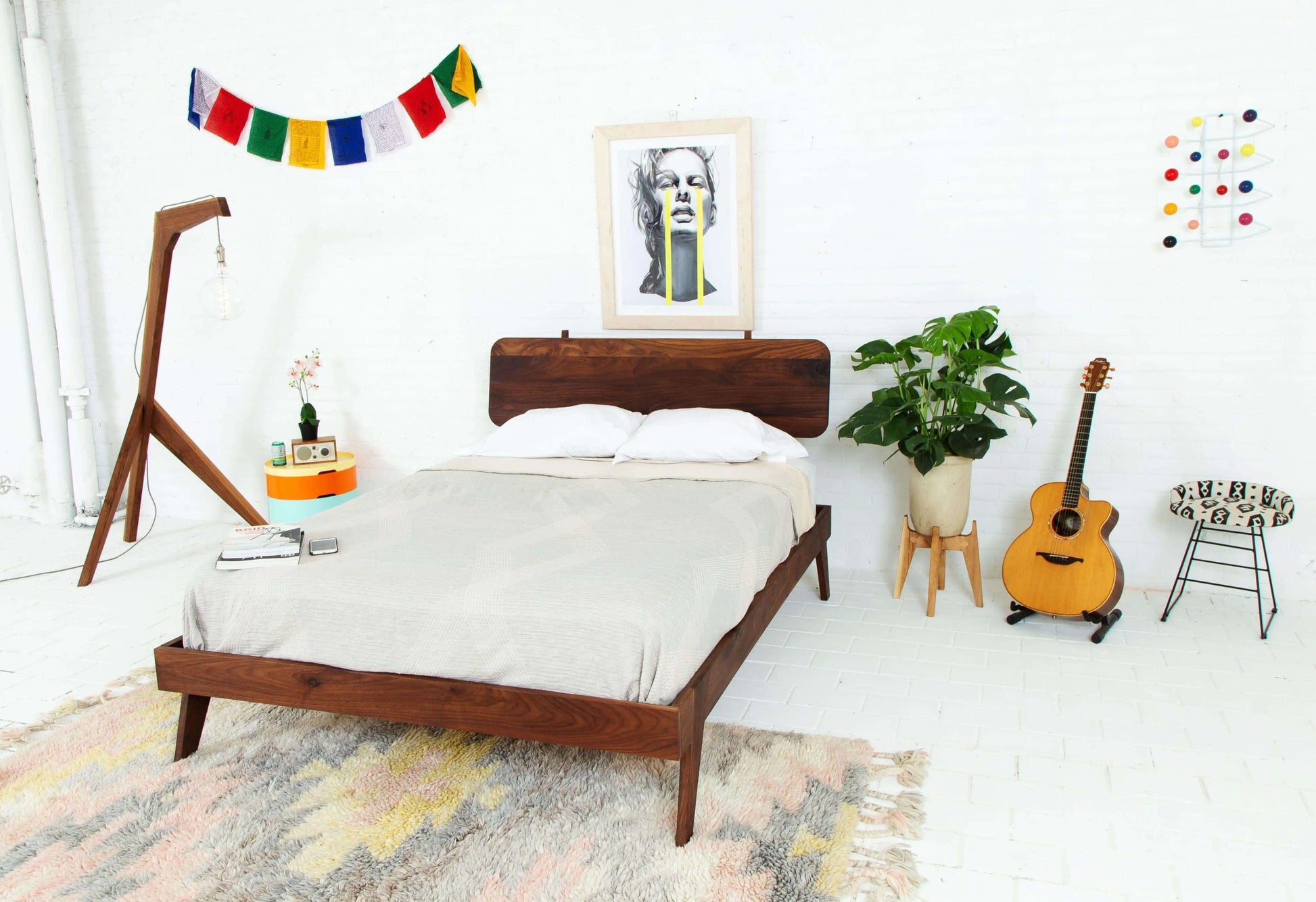 "Handcrafted modern walnut bed frame"