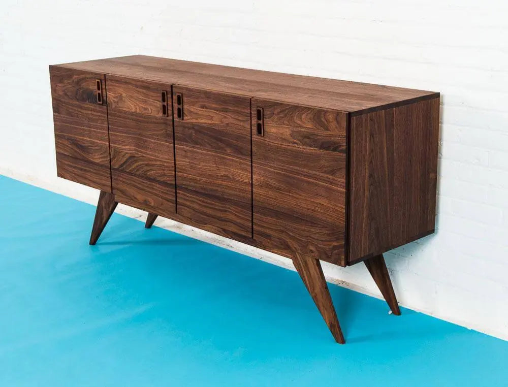 Danish Modern walnut Credenza on Blue floor with White Wall.