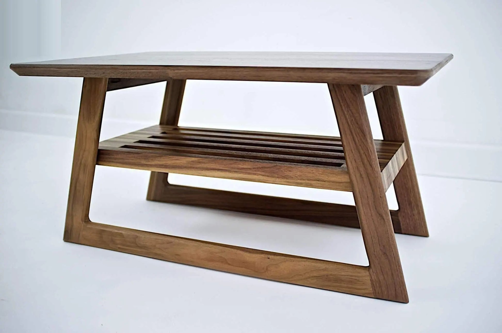 Close-up of "The Clevelander's" 1" solid walnut construction, showcasing the premium craftsmanship characteristic of modern mid-century furniture.