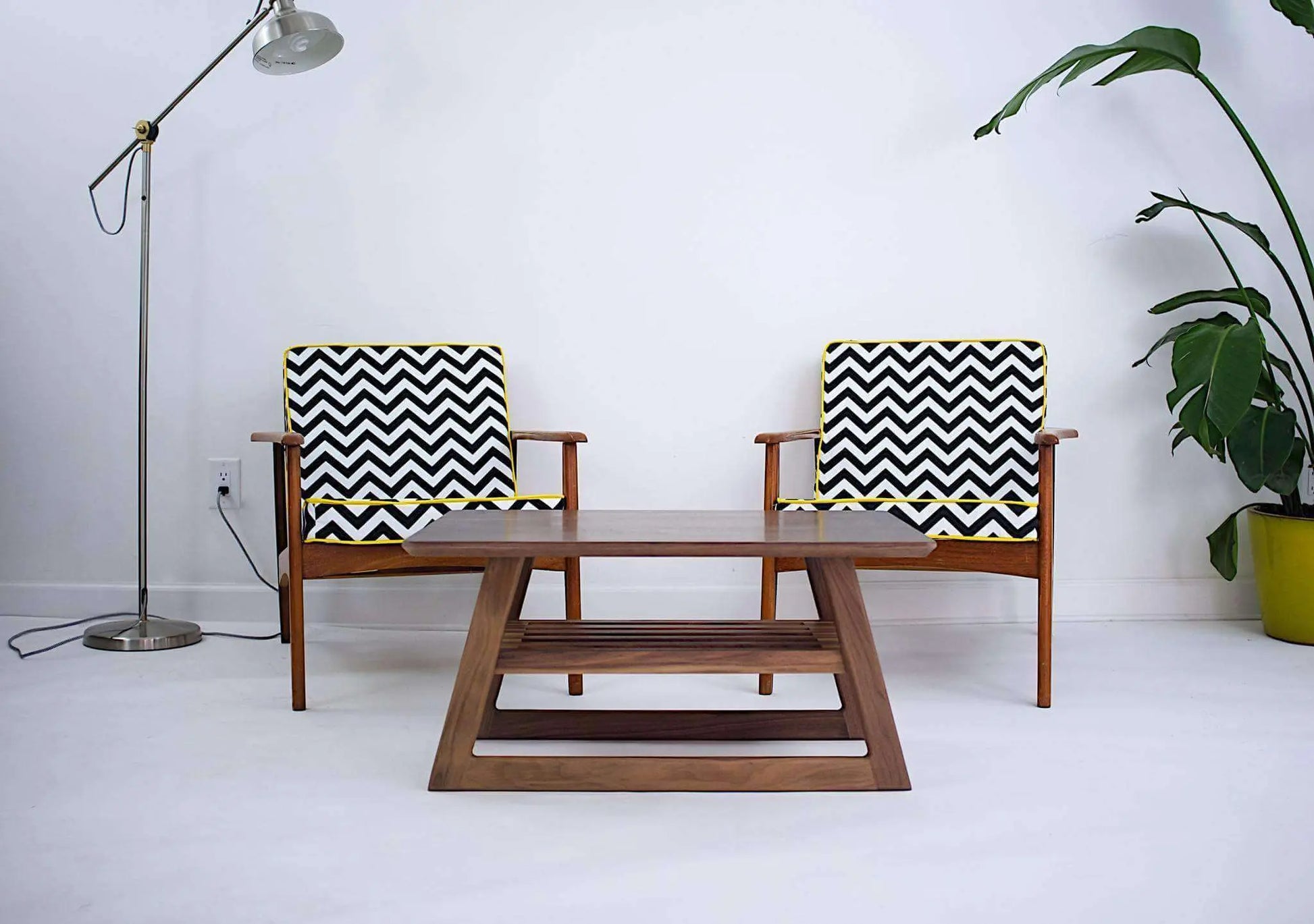 "The Clevelander" set in a minimalist luxury setting, illustrating the sleek design of modern mid-century furniture.