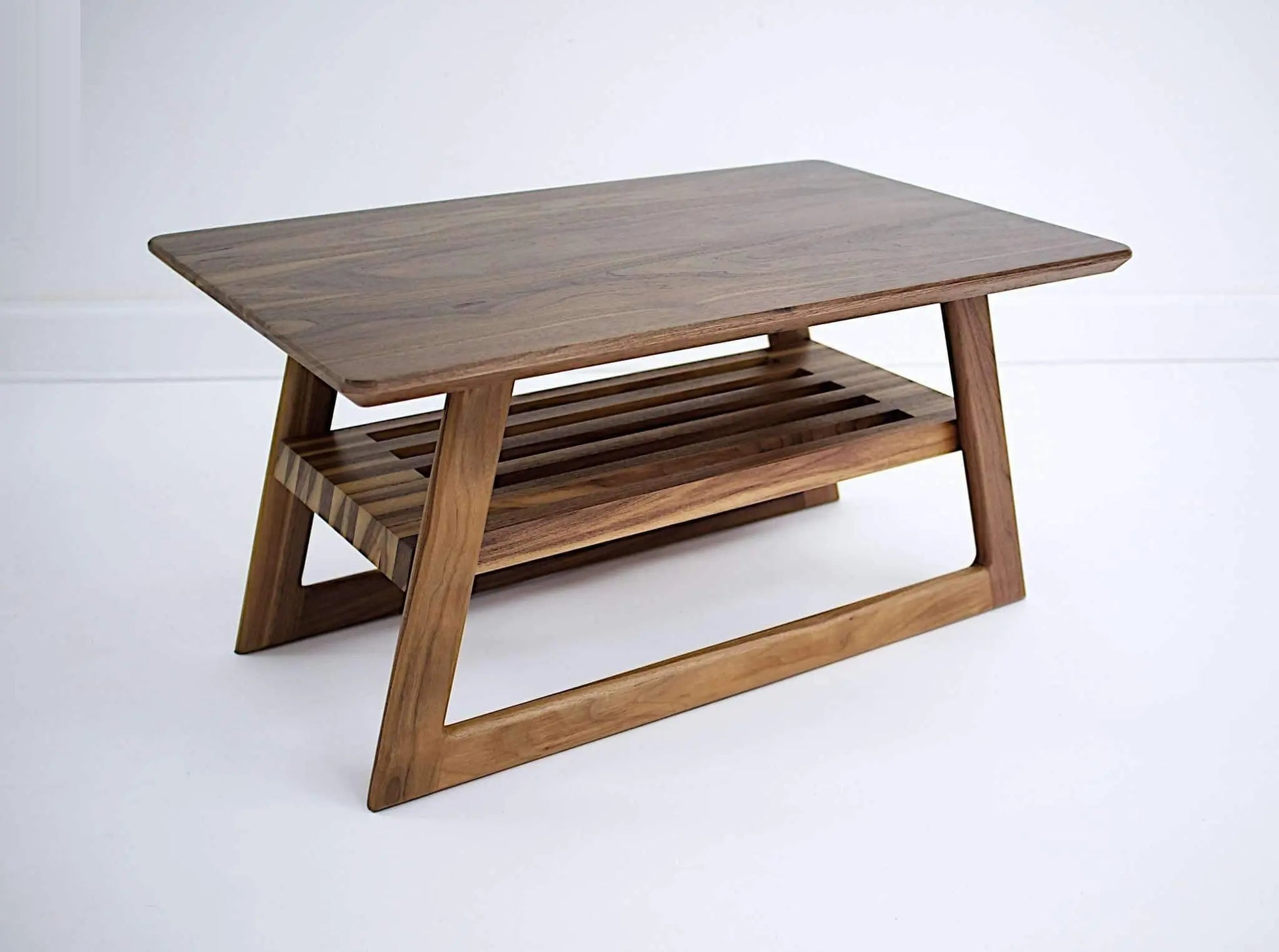 Close-up of "The Clevelander's" walnut surface and varnish finish, emphasizing the quality and luxury of mid-century modern furniture brands.