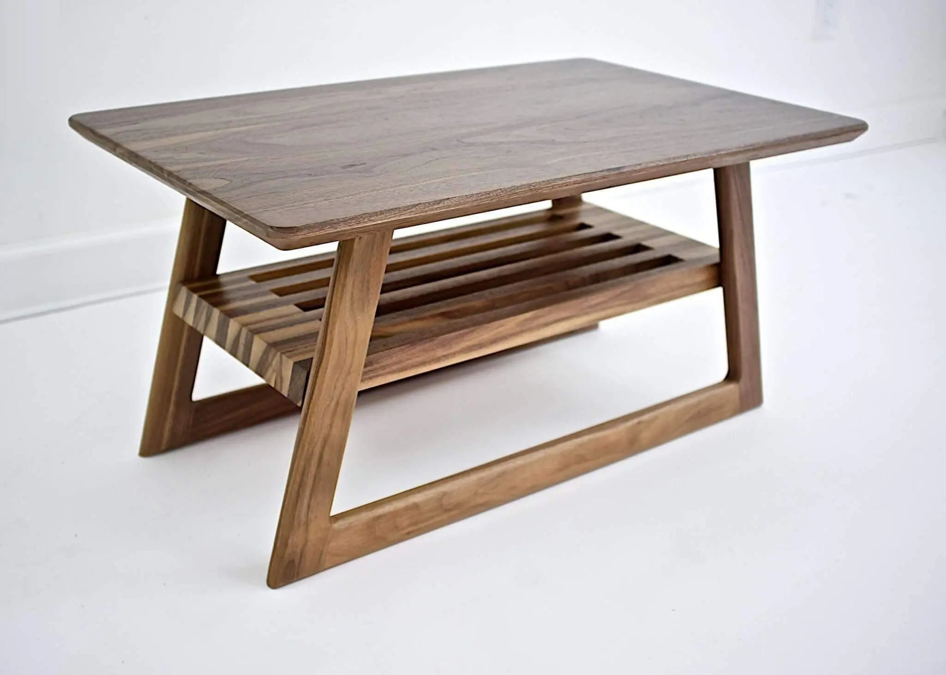 "The Clevelander" coffee table in an elegant home setting, representing the best mid-century modern furniture available online.