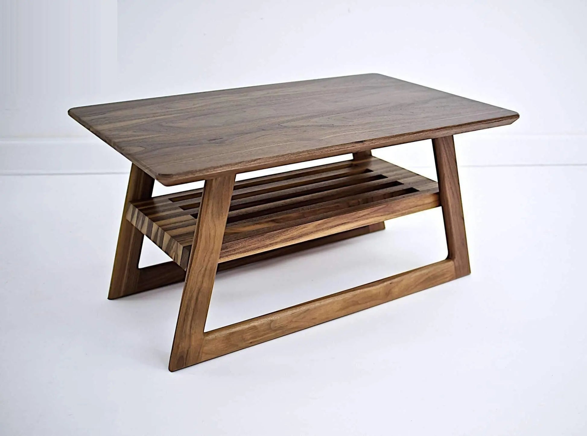 Detail of "The Clevelander's" double beveled tabletop and rounded legs, highlighting the unique design of living room mid-century modern furniture.