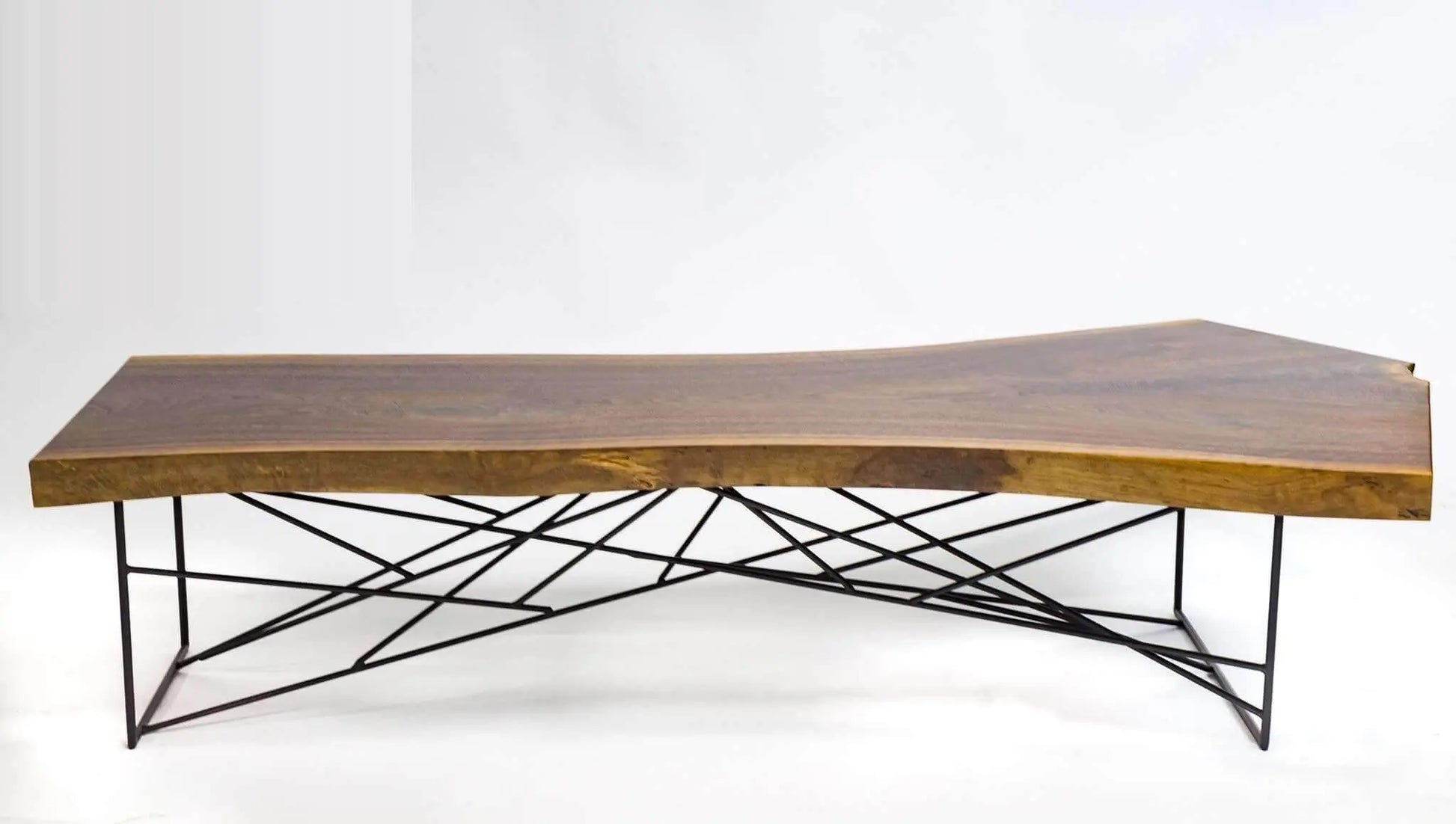 Mid-century walnut dining table with a raw, natural live edge look