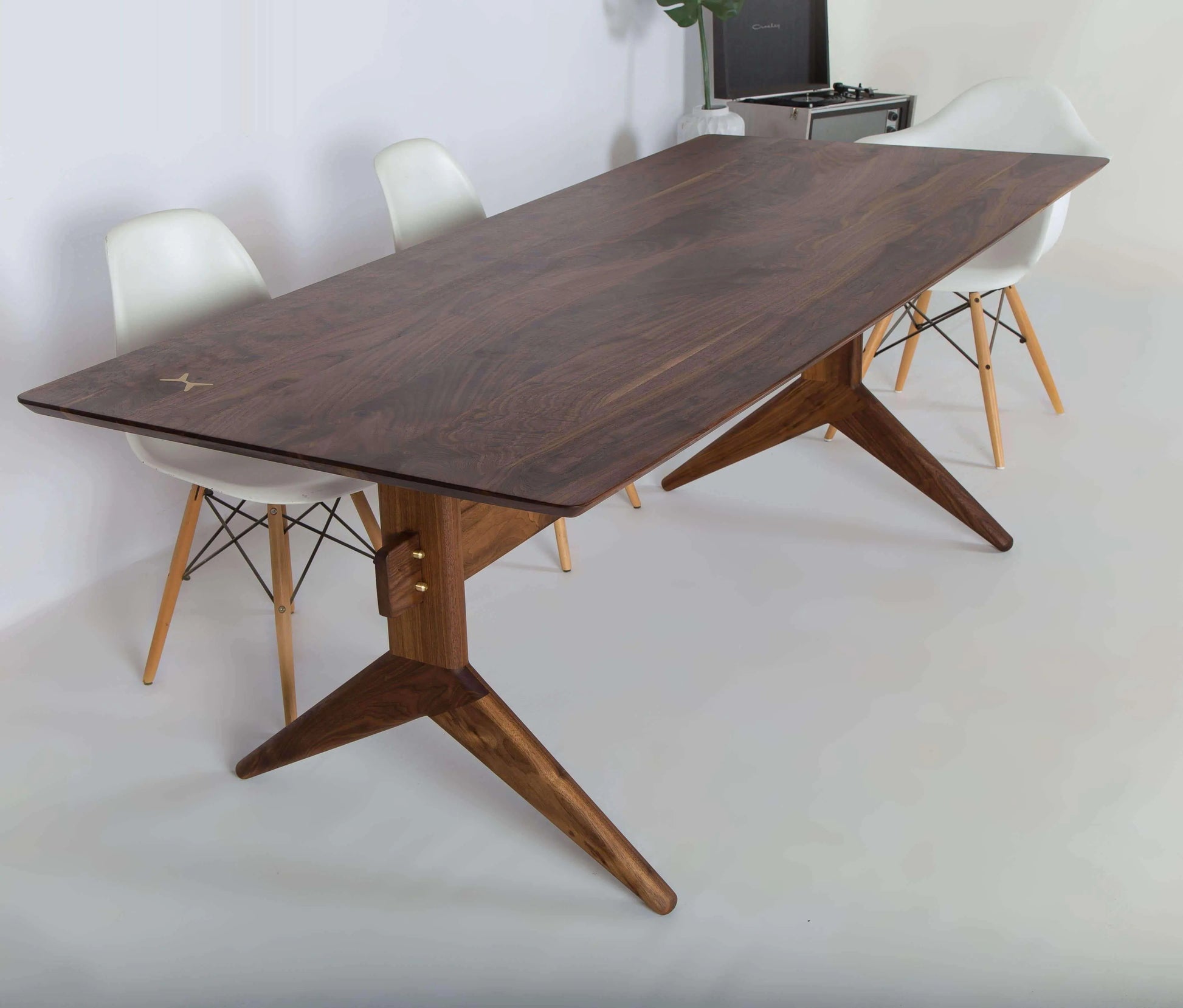 The Lanikai dining table, solid walnut wood with a warm tone