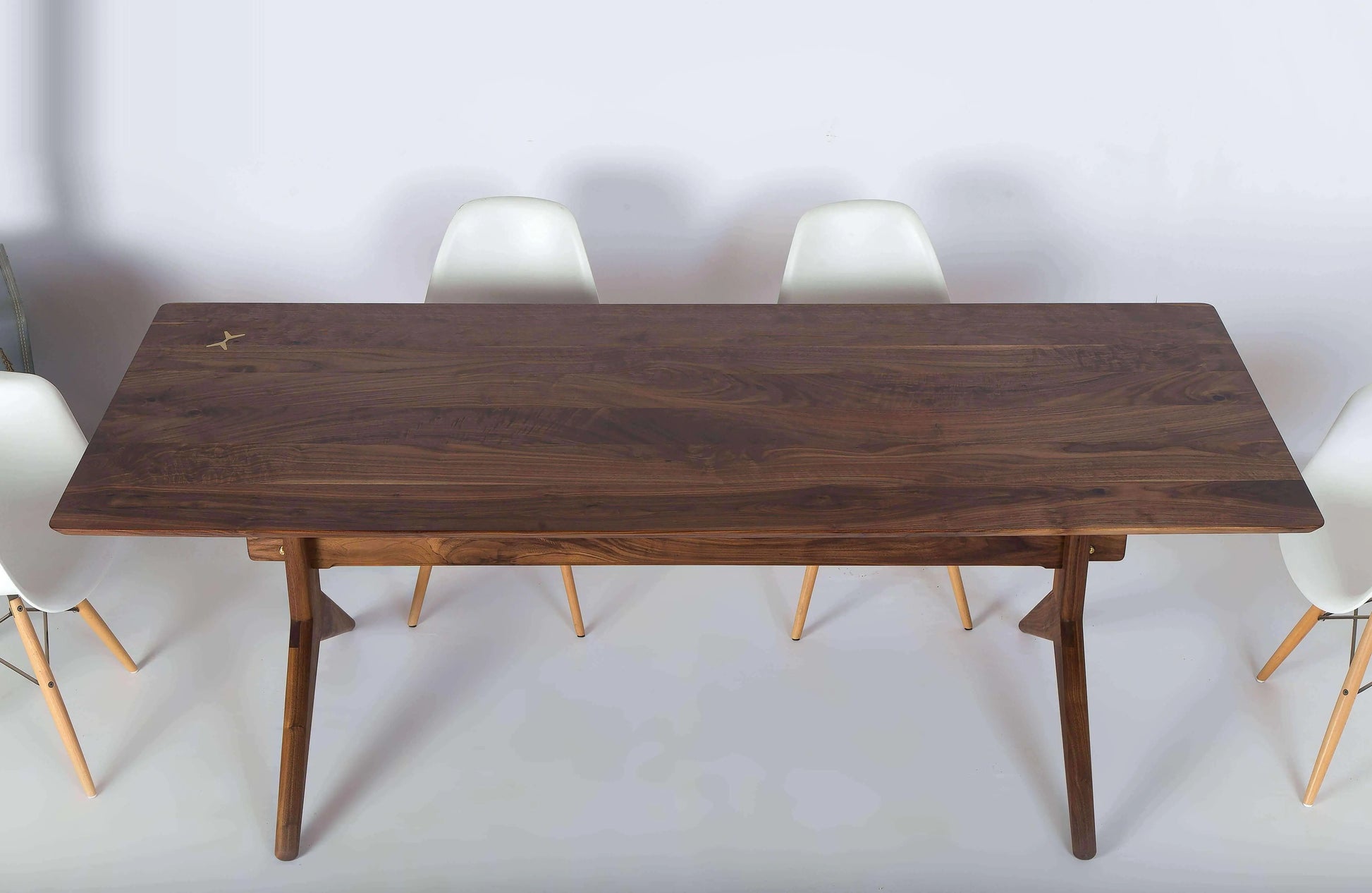 Stylish walnut wood dining table with contemporary design