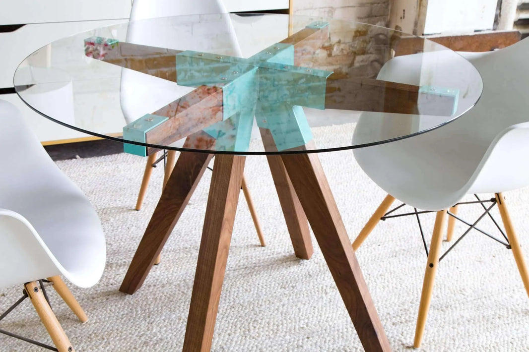 The Maui dining table with tempered glass top and walnut wood legs