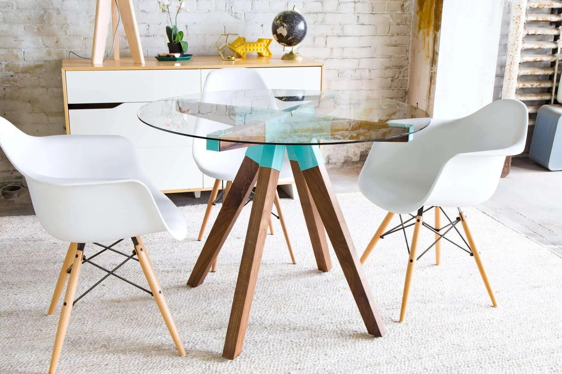 Elegant glass dining table with sculptural wood base, The Maui design