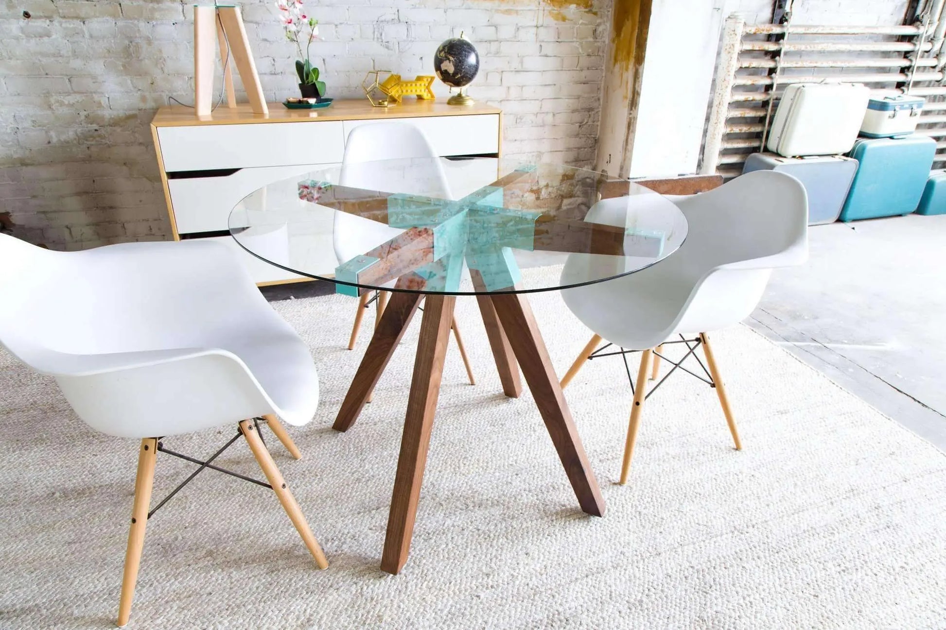 The Maui mid-century dining table with transparent glass surface