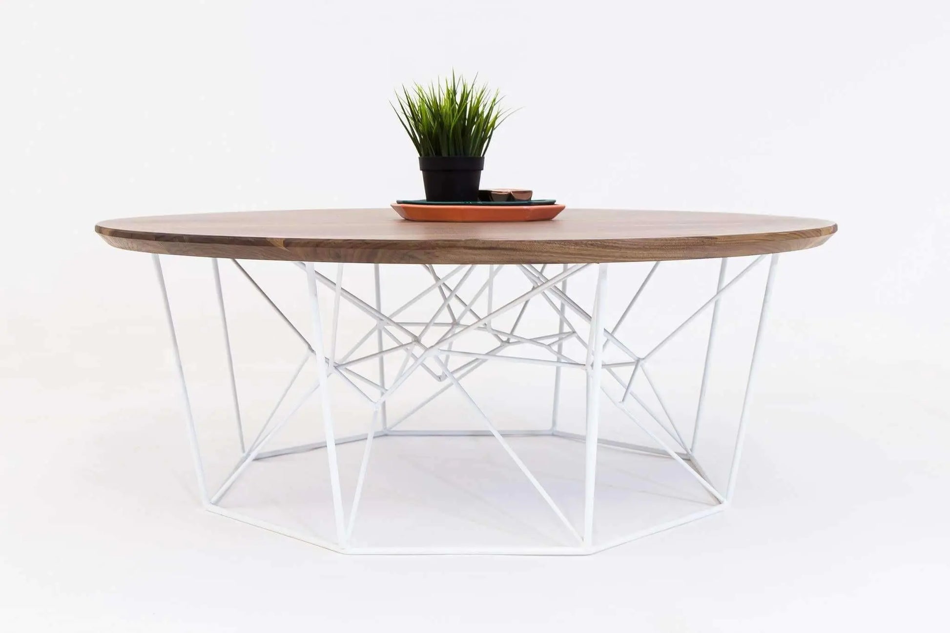 Solid walnut round coffee table with minimalist mid-century appeal