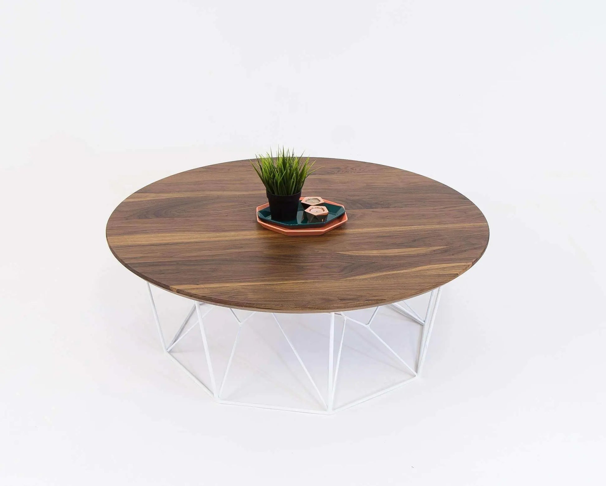 Mid-century modern round coffee table with a rich walnut wood top
