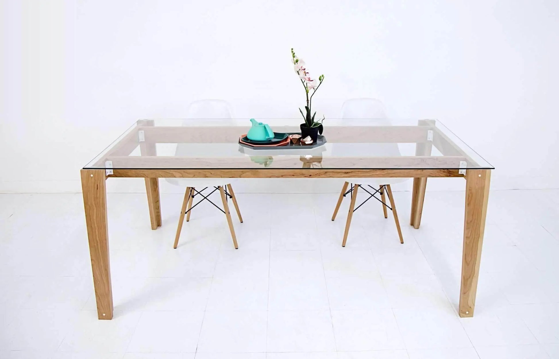 Vintage-inspired glass-top dining table with sturdy frame