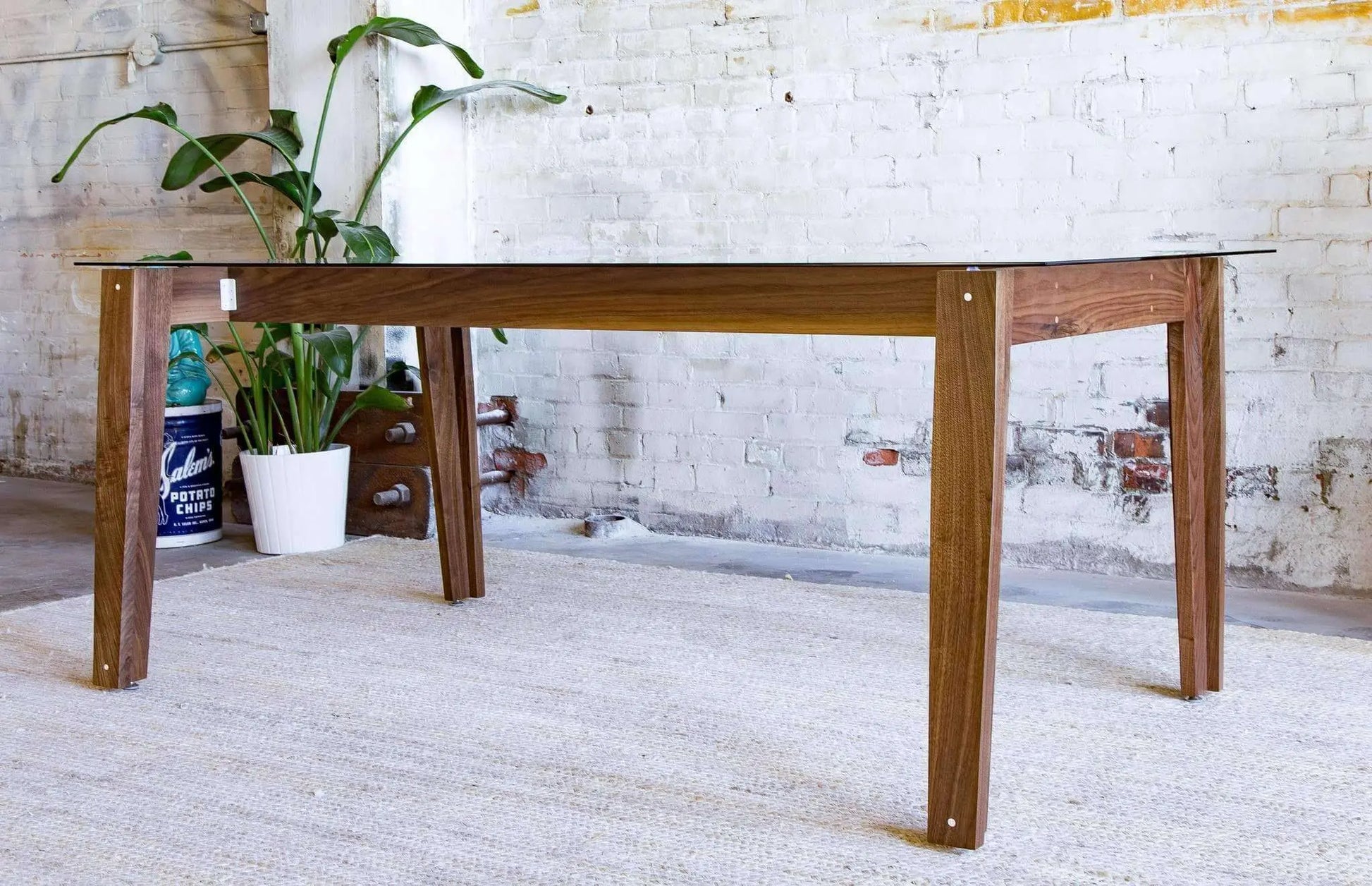 Luxury tempered glass dining table with rich walnut wood base