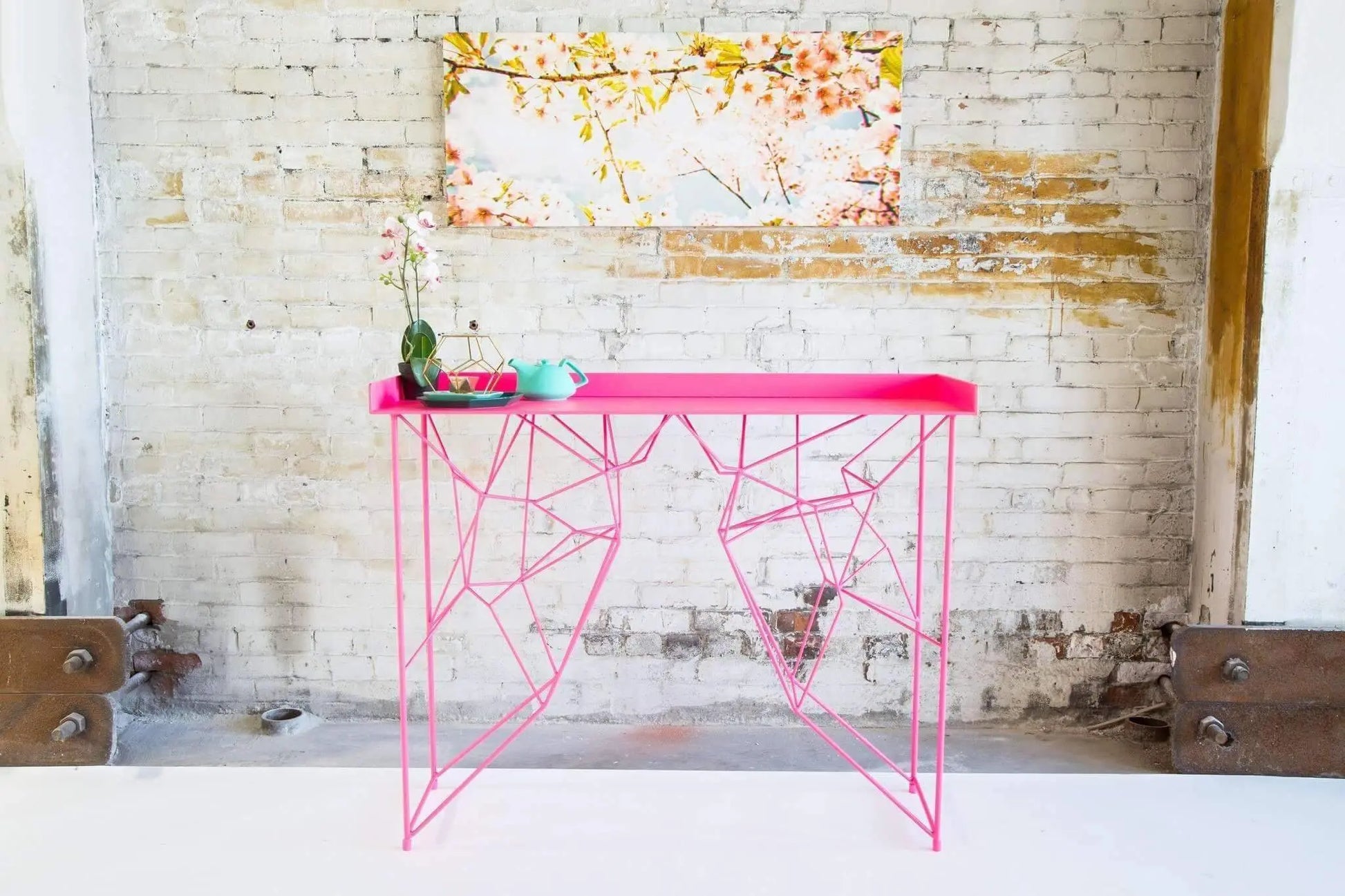 Mid-century inspired pink console table with smooth glossy finish