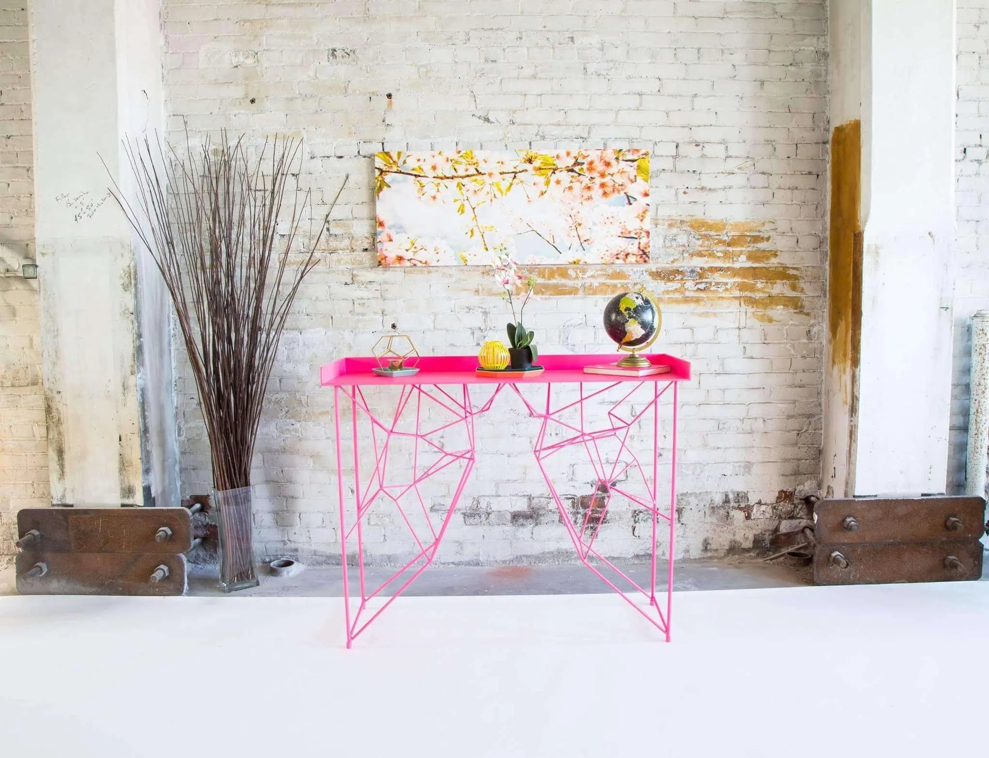 Elegant pink wood console table with a classic mid-century profile