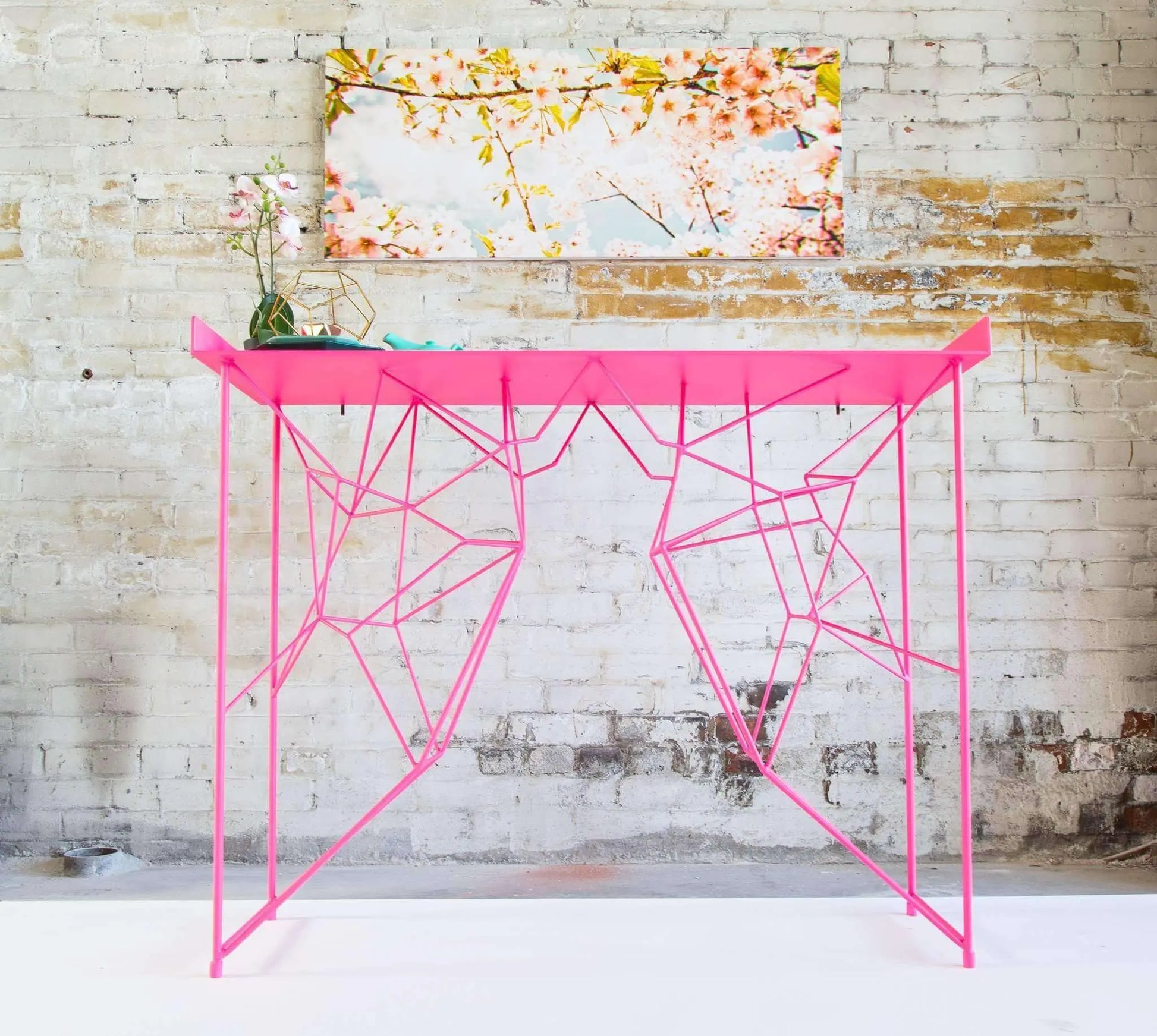 High-end pink console table with minimalist mid-century legs