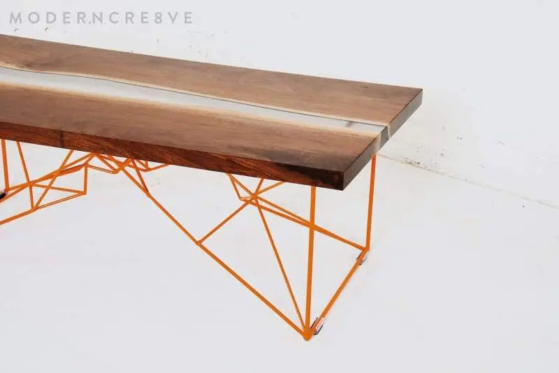 Mid-century modern walnut dining table with a live edge and resin detail