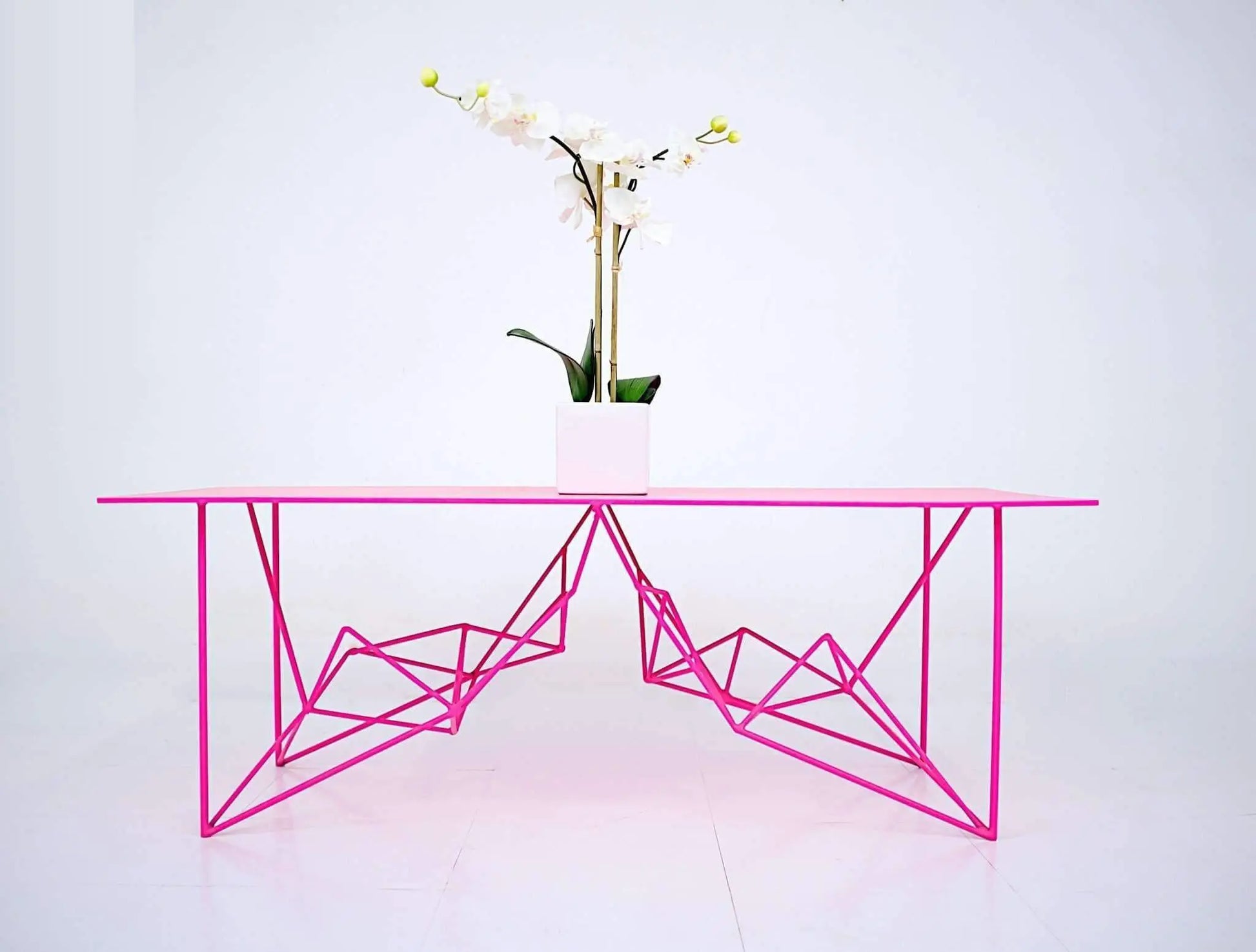 Luxury pink metal console table with a contemporary minimalist look