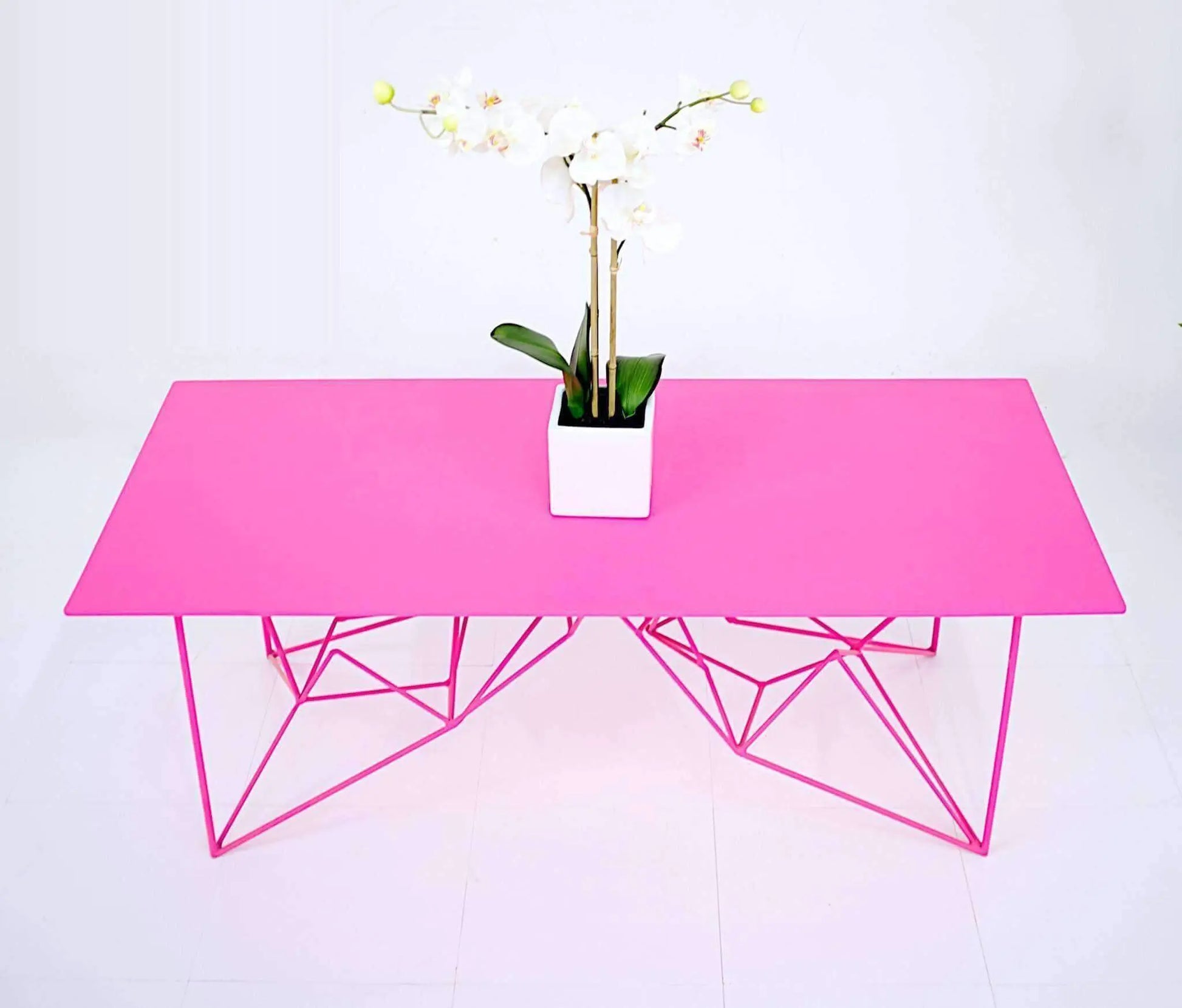 Slim and stylish pink steel console table for modern decor
